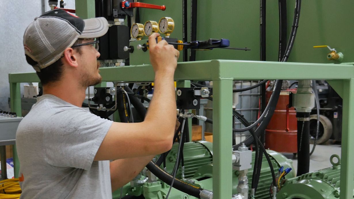 Technician working on a green HPU