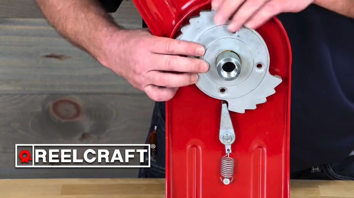 Reelcraft technician adjusting latch mechanism